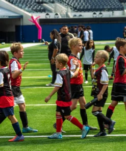 Youth soccer players exchanging high-fiving with opponents